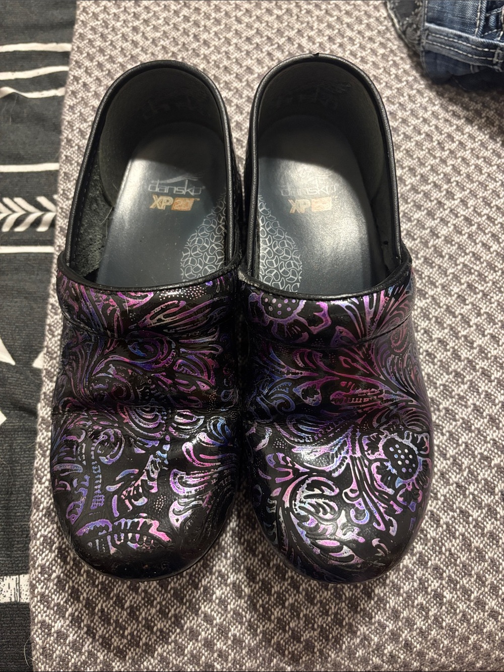 Dansko Women’s Black Iridescent Floral Clogs